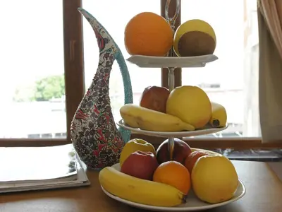two plates of fruit sitting on top of a table at Best Town Hotel in Istanbul