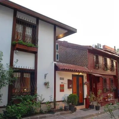 a group of buildings with plants in front of them at Villa Sphendone Suites Istanbul in Istanbul