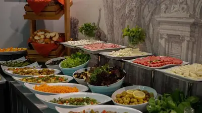 a buffet with many plates of food on a table at Raymond Hotel Old City in Istanbul