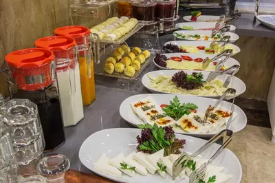 a buffet with plates of food on a table at Gulec Hotel & Spa - Special Category in Istanbul