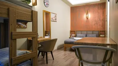a bedroom with a bunk bed and a desk at Second Home Hostel in Istanbul