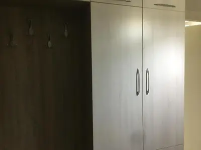 a white cabinet in a room with a wall at Bandirma Saglik Apart in Bandırma