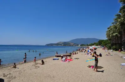 a group of people on a beach in the water at Bandirma Saglik Apart in Bandırma
