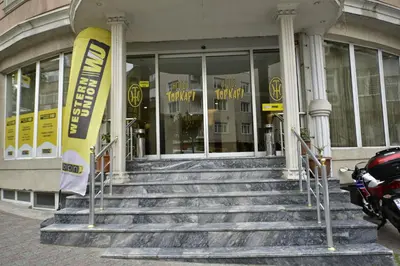 a building with stairs in front of a store at Hotel Topkapı in Istanbul
