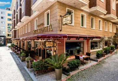 a restaurant with tables and chairs outside of a building at Hotel Sultania Boutique Class in Istanbul
