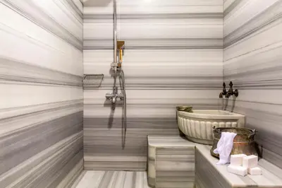 a bathroom with a tub and a sink at Hotel Sultania Boutique Class in Istanbul