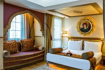 a bedroom with a bed and a couch at Hotel Sultania Boutique Class in Istanbul