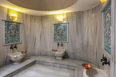 a bathroom with two toilets and a sink at Hotel Sultania Boutique Class in Istanbul