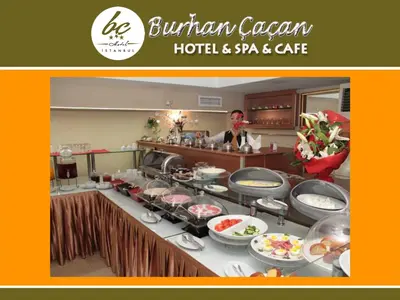 a buffet line with food and a person in the background at BC Burhan Cacan Hotel & Spa & Cafe in Istanbul