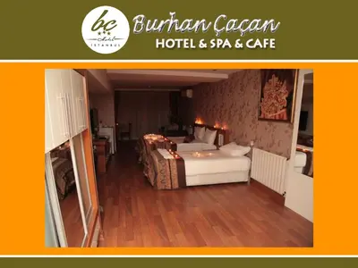 a bedroom with a bed in a room with wooden floors at BC Burhan Cacan Hotel & Spa & Cafe in Istanbul