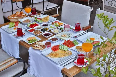 a table topped with plates of food and drinks at Senatus Hotel - Special Class in Istanbul
