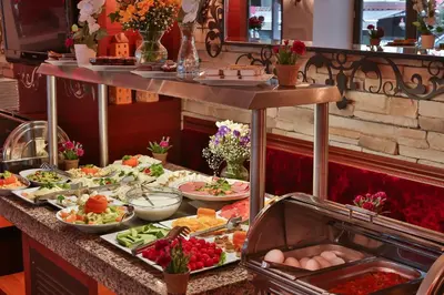 a buffet line with many different types of food at Senatus Hotel - Special Class in Istanbul