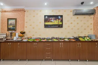 a kitchen with a counter with food on it at May Hotel Istanbul in Istanbul