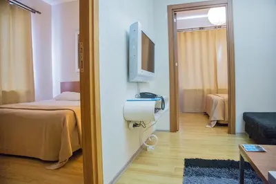 a room with a bedroom with a bed and a television at Airport Residence in Istanbul