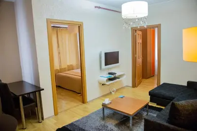 a small living room with a couch and a table at Airport Residence in Istanbul