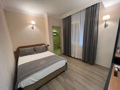 a hotel room with a bed in a room at Fuar Hotel in Istanbul