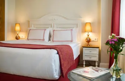 a bedroom with a white bed with two pillows at Amofta Hotel Taksim in Istanbul