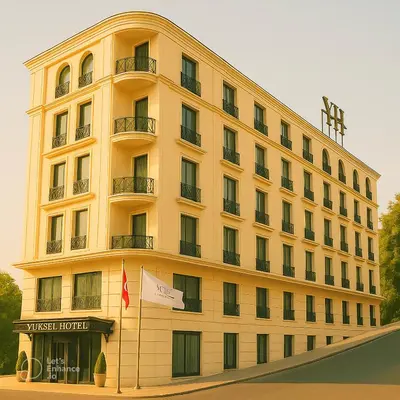 a large yellow building with a flag in front of it at Yuksel Istanbul Yenikapı Hotel in Istanbul