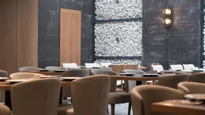 a row of tables and chairs in a restaurant at Yuksel Istanbul Yenikapı Hotel in Istanbul