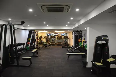a gym with treadmills and machines in a room at Heybeli Hotel in Mudanya