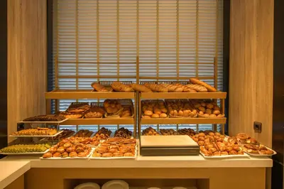 a bakery with lots of different types of bread at Golden Age Hotel Taksim in Istanbul