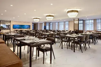 a large dining room with tables and chairs at Golden Age Hotel Taksim in Istanbul