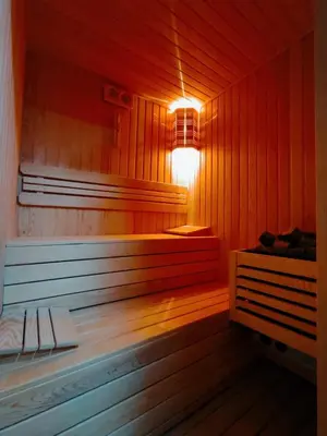 a sauna with a light on the inside of it at Hill River Hotel in Agva