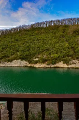 a view of a body of water from a bridge at Hill River Hotel in Agva