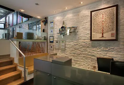 a restaurant with a stone wall and a staircase at Jazz Hotel Nisantasi in Istanbul