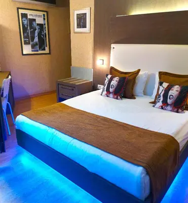 a hotel room with a large bed with lights on it at Jazz Hotel Nisantasi in Istanbul