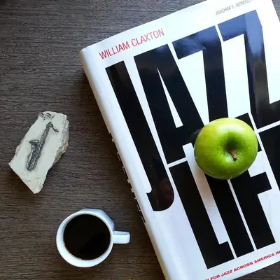 a book and an apple and a cup of coffee at Jazz Hotel Nisantasi in Istanbul