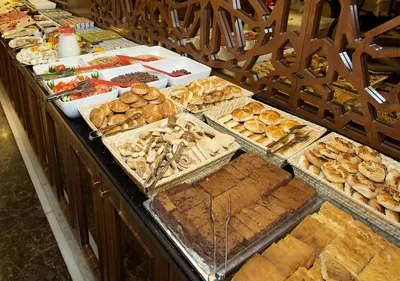 a buffet line with many different types of pastries at Tilia Hotel in Istanbul