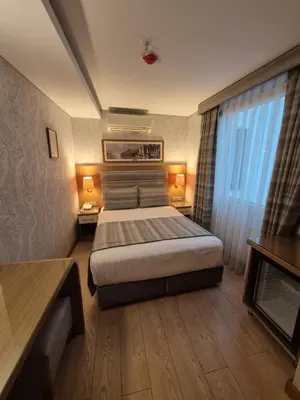 a hotel room with a bed and a window at İstanbul Trend Hotel Old City in Istanbul
