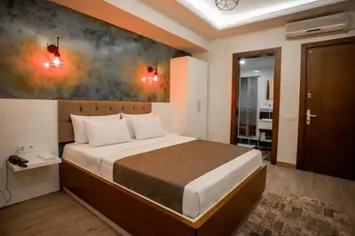 a bedroom with a bed and a painting on the wall at Hotel Pera Capitol - Taksim & İstiklal in Istanbul