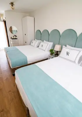 two beds sitting next to each other in a room at Cheers Vera Edition Hotel in Istanbul