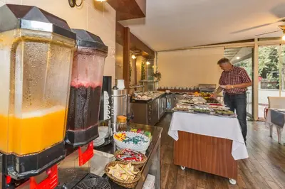 a man standing in front of a table with food at The Empress Theodora Hotel in Istanbul