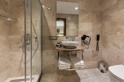 a bathroom with a sink and a shower with a sink at Endless Art Hotel-Special Category in Istanbul