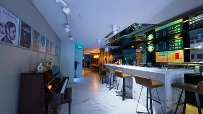 a bar in a restaurant with chairs and a counter at Endless Art Hotel-Special Category in Istanbul