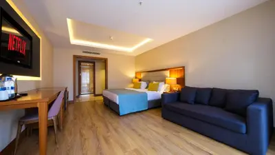 a hotel room with a bed and a couch at Endless Art Hotel-Special Category in Istanbul