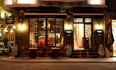 a restaurant with tables and chairs outside at night at Hypnos Design Hotel in Istanbul