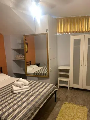 a bedroom with a bed and a mirror at Volare Apart in Istanbul