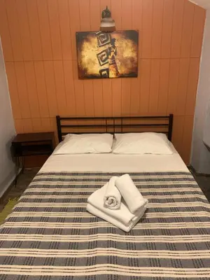 a bed with two towels sitting on top of it at Volare Apart in Istanbul