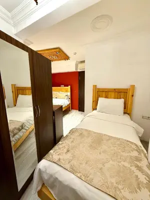 a bedroom with two beds in a room at Magnificent Hotel in Istanbul