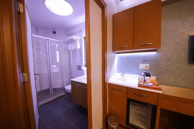 a small bathroom with a sink and a shower at Cumbali Luxury Boutique Hotel in Istanbul