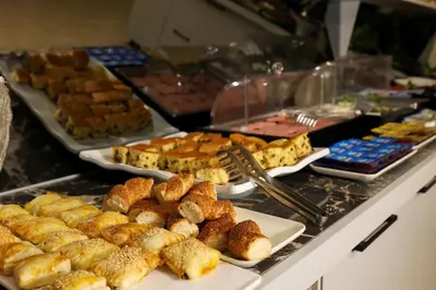 a buffet filled with different types of food on plates at Cumbali Luxury Boutique Hotel in Istanbul