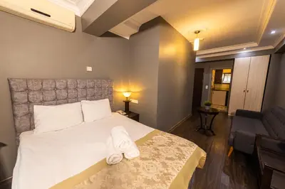 a bedroom with a bed with white towels on it at Cumbali Luxury Boutique Hotel in Istanbul