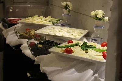 a buffet with several plates of food on a table at Elibol Hotel Old City in Istanbul