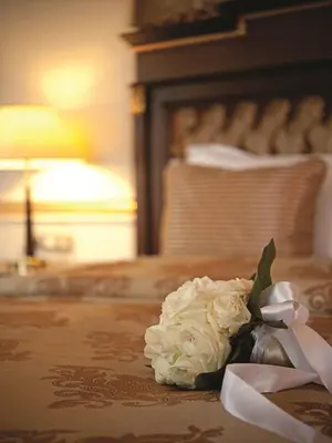 a bouquet of white roses sitting on a table at Crowne Plaza Istanbul Asia by IHG in Istanbul