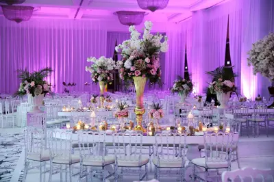 a wedding reception with white tables and chairs and pink walls at Crowne Plaza Istanbul Asia by IHG in Istanbul