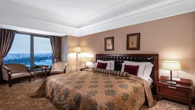 a hotel room with a bed and a large window at Crowne Plaza Istanbul Asia by IHG in Istanbul